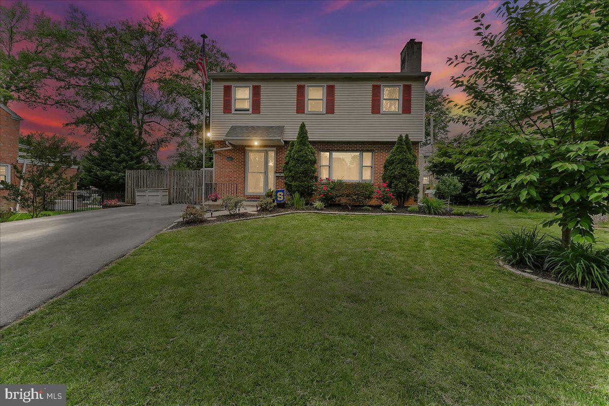 208 Rambling Way Springfield, PA 19064 - Photo 35 of 39 a front view of a house with a yard and trees