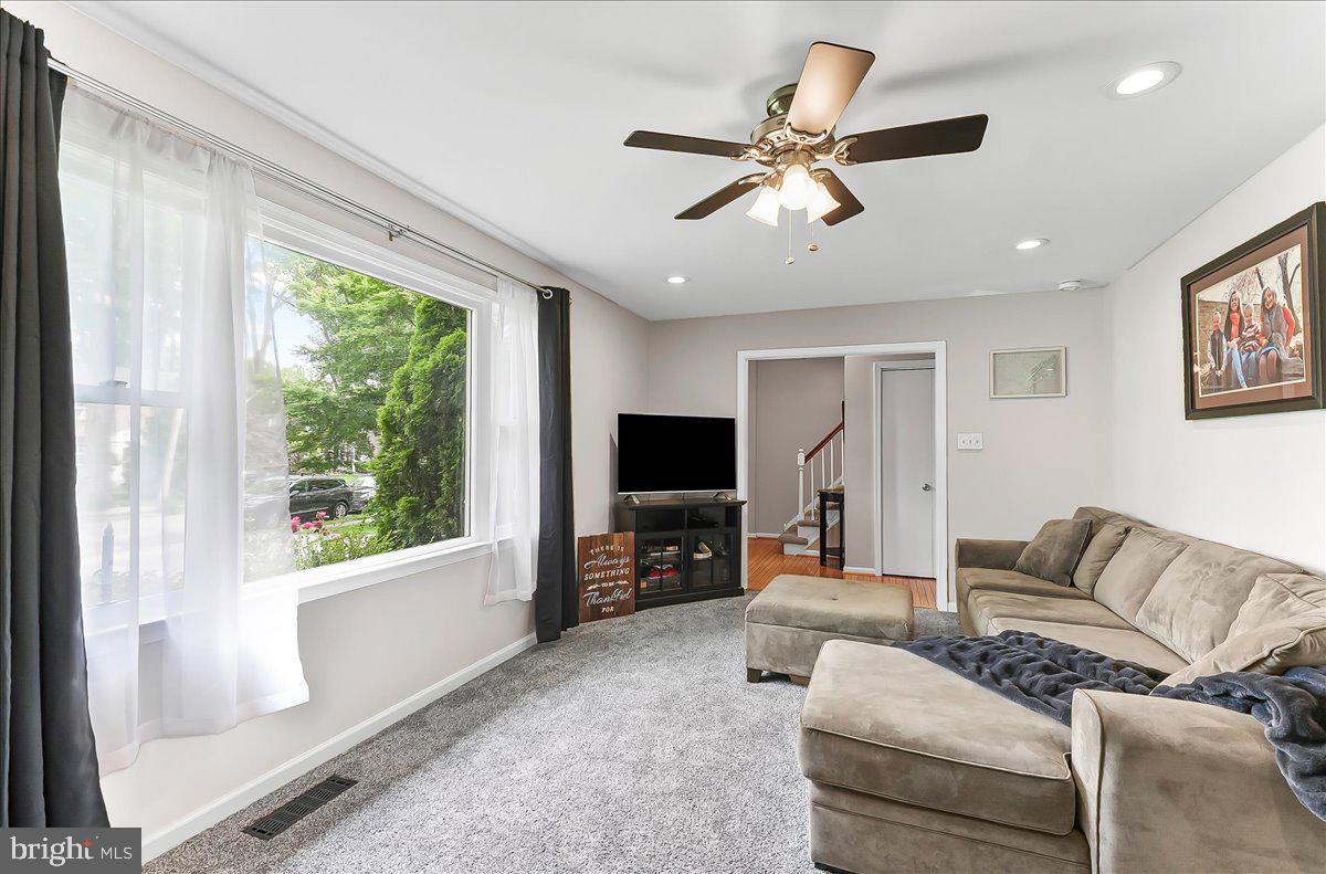 208 Rambling Way Springfield, PA 19064 - Photo 7 of 39 a living room with furniture and a flat screen tv