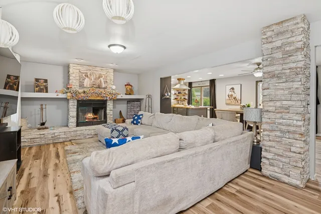 a living room with furniture and a fireplace