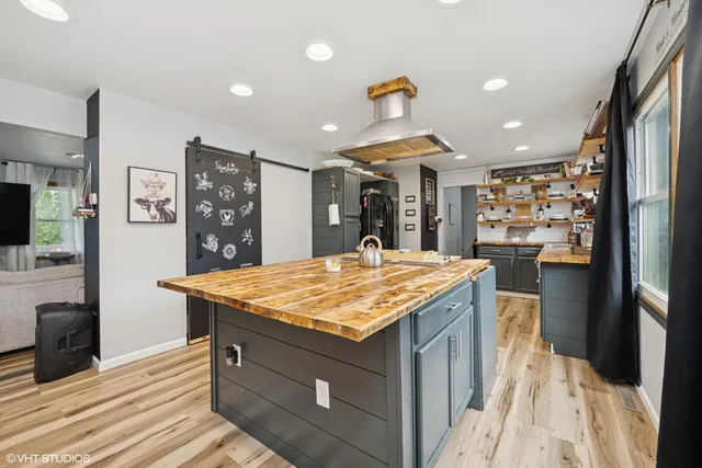 a kitchen with a sink and a refrigerator