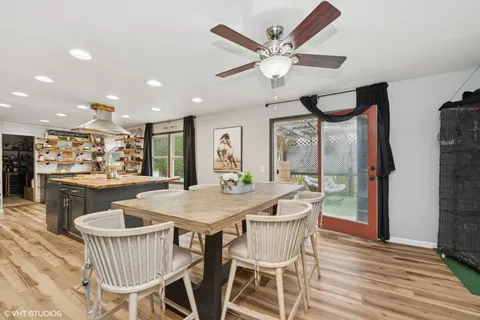 a dining room with furniture and window