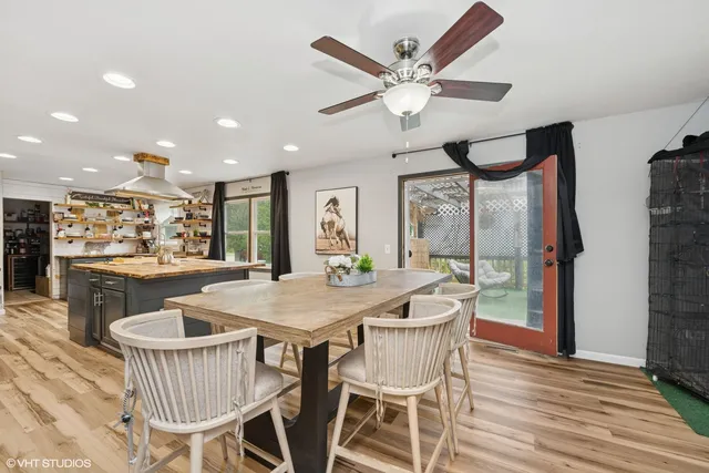 a dining room with furniture and window
