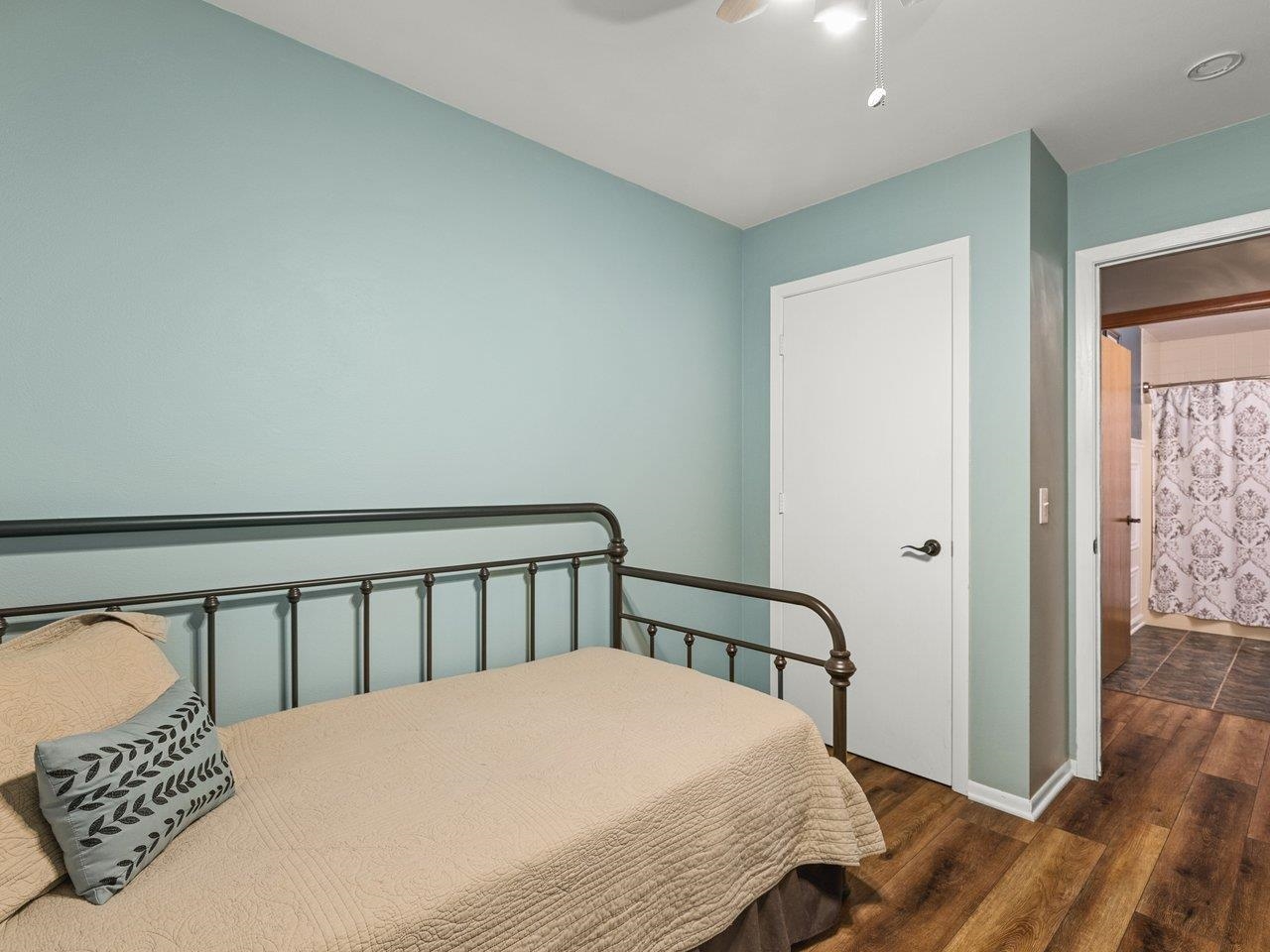 1816 Post Road Beloit, WI 53511 - Photo 25 of 42 a bedroom with a bed and wooden floor