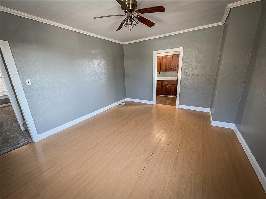 405 2nd Street Butler, PA 16001 - Photo 13 of 24 an empty room with wooden floor closet and windows