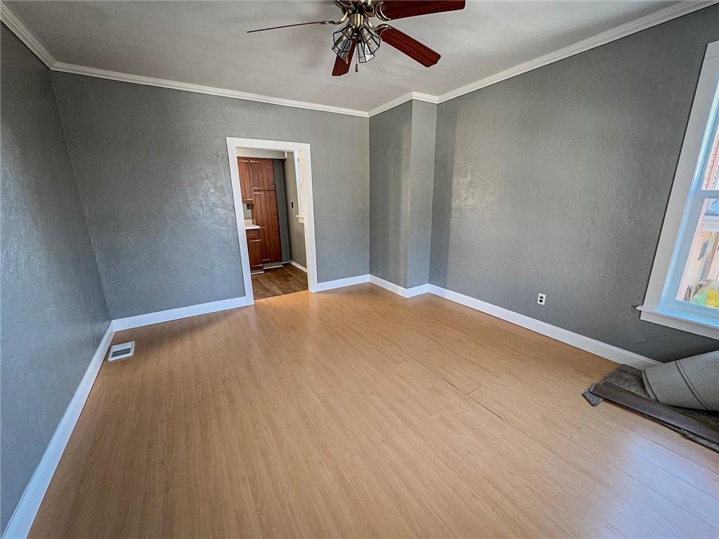 405 2nd Street Butler, PA 16001 - Photo 14 of 24 a view of a livingroom with a ceiling fan and window