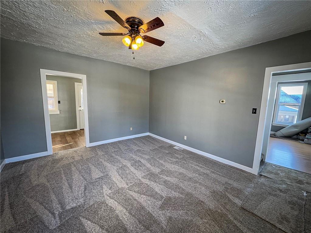 405 2nd Street Butler, PA 16001 - Photo 6 of 24 a view of a big room with wooden floor and chandelier fan