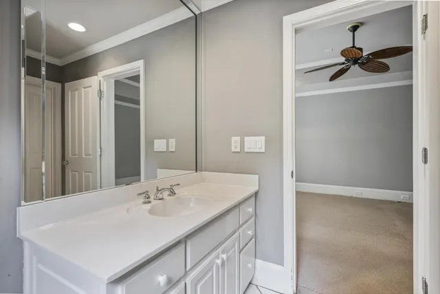 a bathroom with a sink a mirror and shower