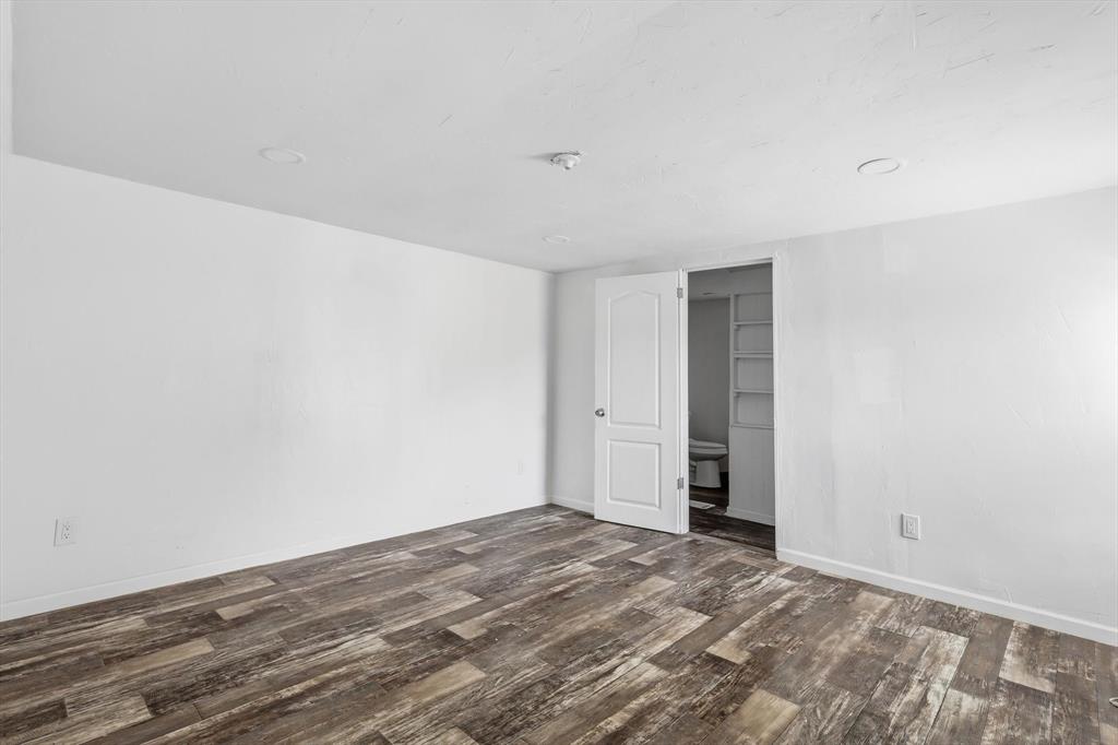 316 Summit Drive Springtown, TX 76082 - Photo 25 of 39 This room features hardwood style flooring, recessed ceiling lights, and white walls