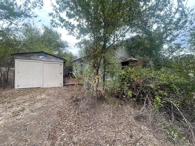 a backyard of a house with lots of green space