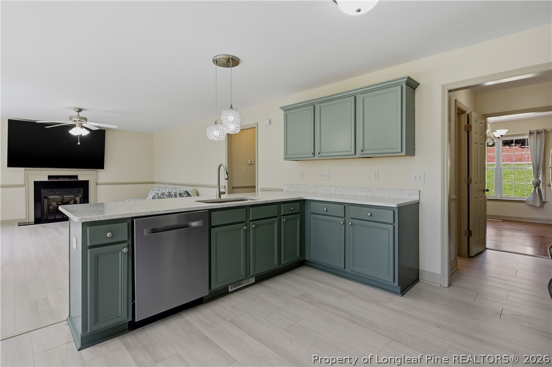 1075 Buffalo Lake Road Sanford, NC 27332 - Photo 17 of 49 a kitchen with granite countertop a sink and cabinets