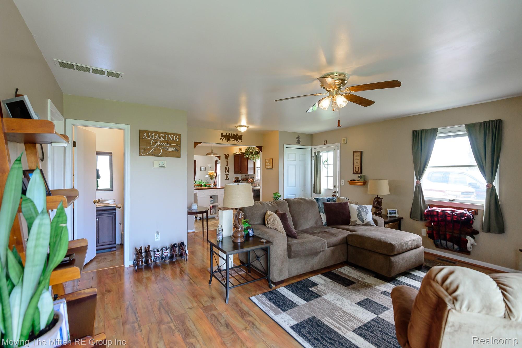 9260 Pitman Road Ypsilanti, MI 48197 - Photo 6 of 45 Living room with ceiling fan and hardwood / wood-style flooring