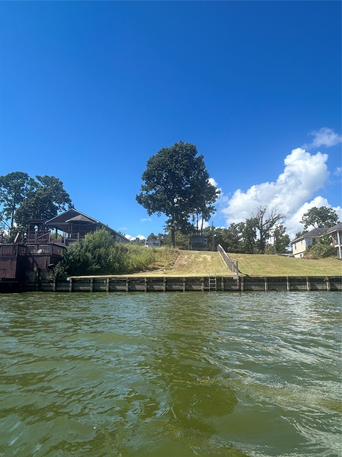 255 Key Largo Loop Point Blank, TX 77364 - Photo 11 of 13 a view of a lake with a mountain