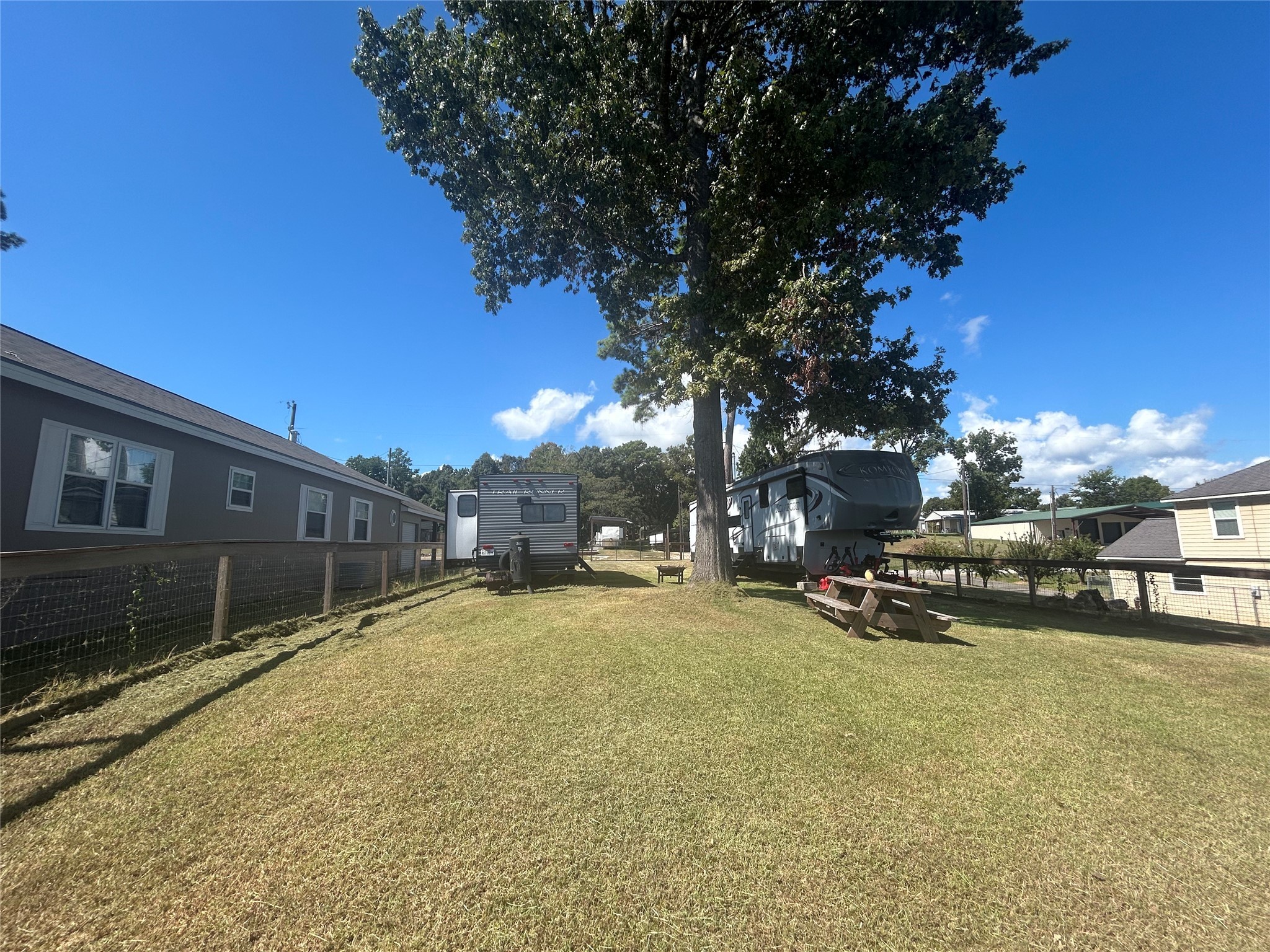 255 Key Largo Loop Point Blank, TX 77364 - Photo 9 of 13 a view of a playground with a tree