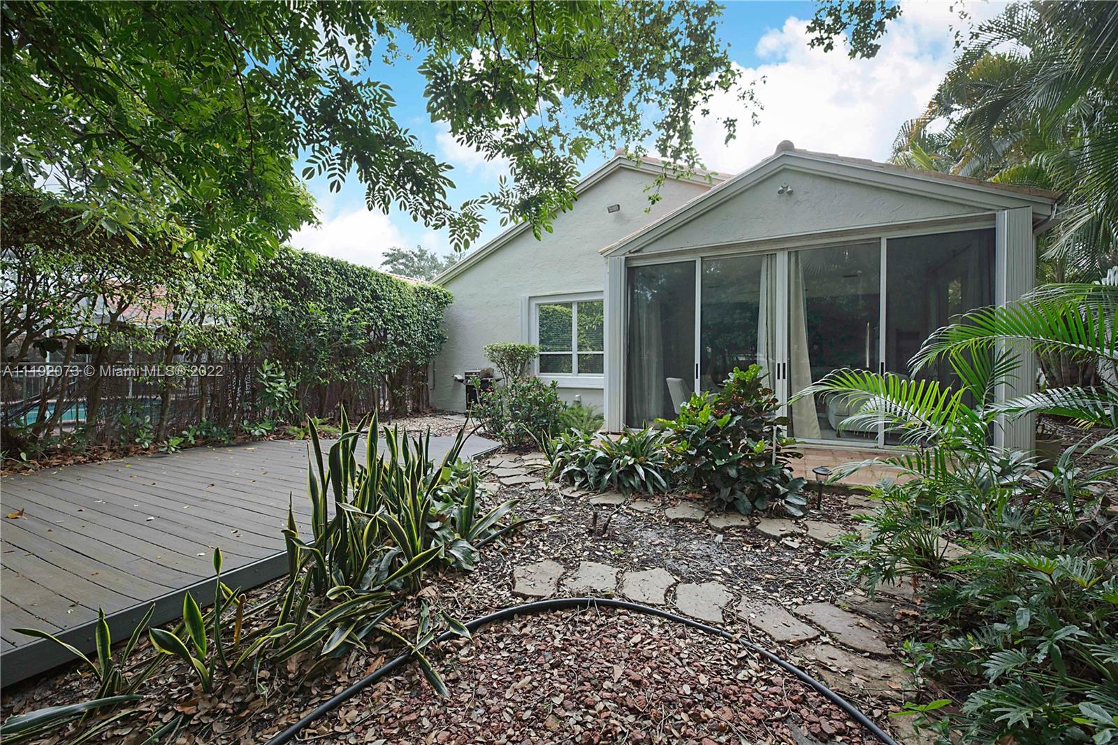 17287 Antigua Point Way Boca Raton, FL 33487 - Photo 34 of 47 a view of a house with a flower garden