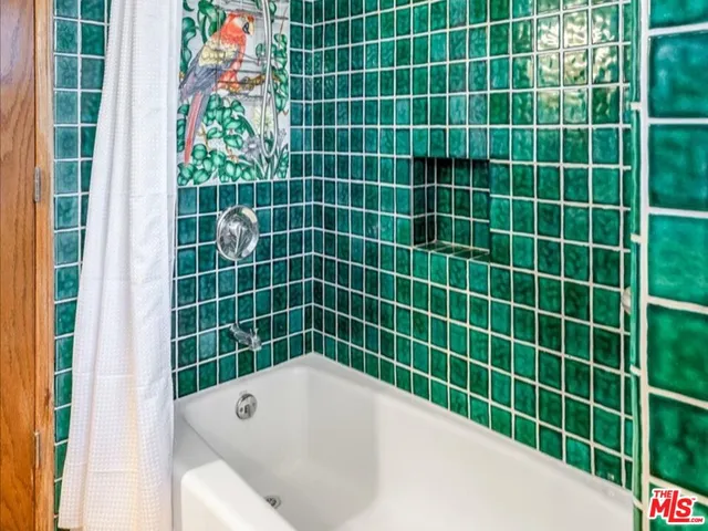 a bathroom with a bath tub