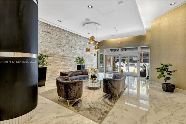 a living room with furniture and a large window