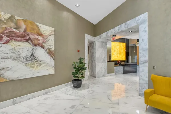 a view of a swimming pool with outdoor seating