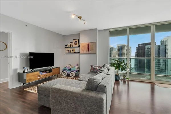 a bedroom with a bed and a tv on table
