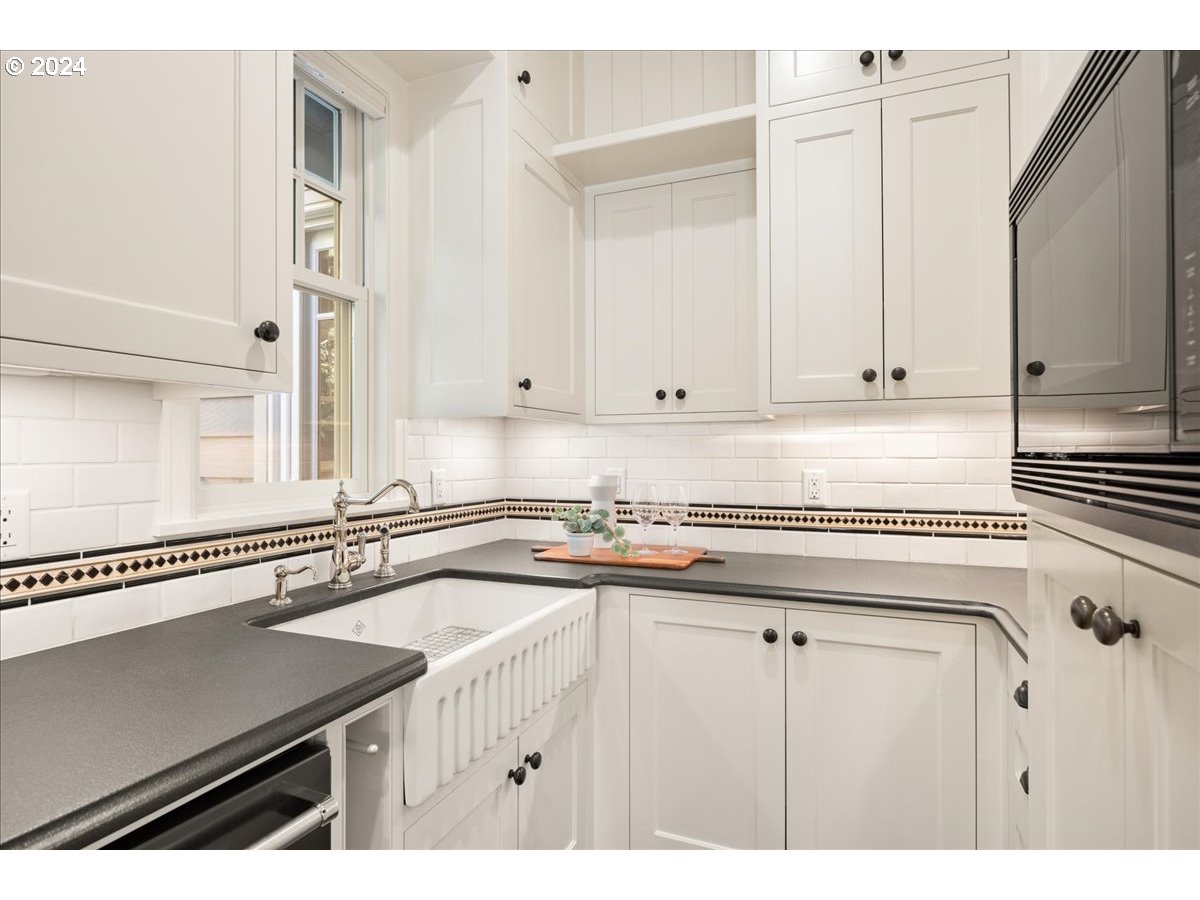 3528 Southwest 64th Place Portland, OR 97221 - Photo 12 of 48 a kitchen with a sink and cabinets