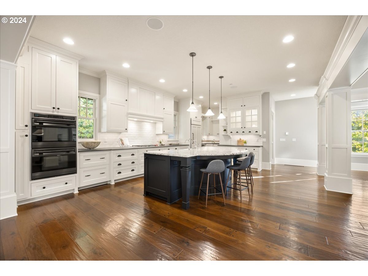 3528 Southwest 64th Place Portland, OR 97221 - Photo 14 of 48 a large kitchen with a table and chairs