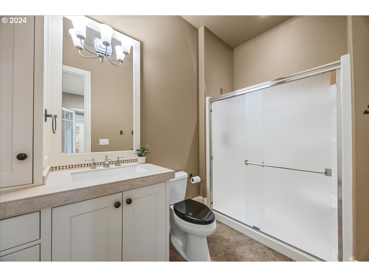 3528 Southwest 64th Place Portland, OR 97221 - Photo 19 of 48 a bathroom with a sink and a mirror