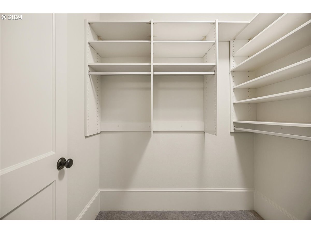 3528 Southwest 64th Place Portland, OR 97221 - Photo 35 of 48 a view of walk in closet with empty racks