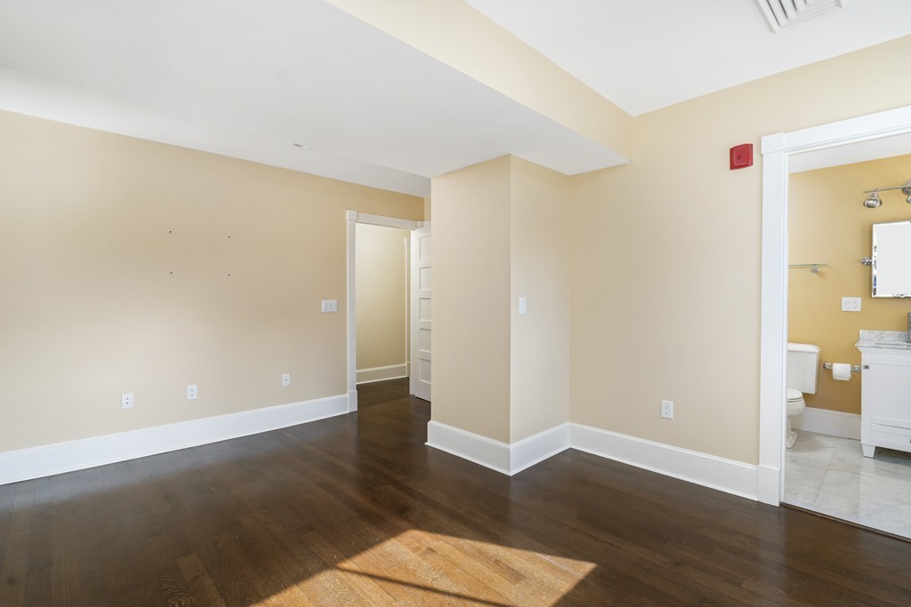 423 Hope Street, Unit 1A Bristol, RI 02809 - Photo 13 of 26 a view of an empty room with wooden floor