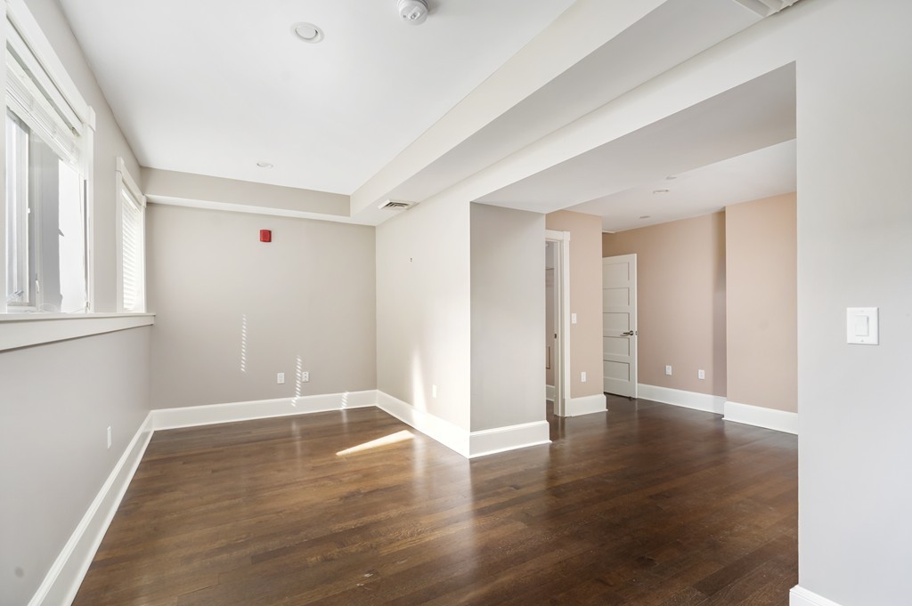 423 Hope Street, Unit 1A Bristol, RI 02809 - Photo 17 of 26 a view of an empty room with wooden floor