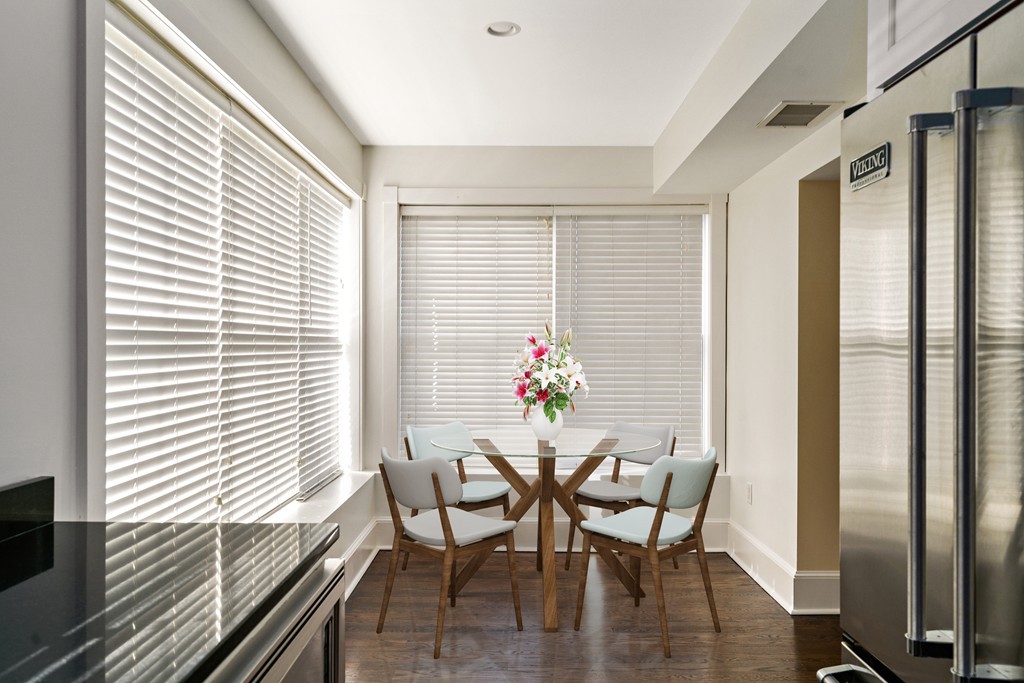 423 Hope Street, Unit 1A Bristol, RI 02809 - Photo 8 of 26 a view of a dining room with furniture and wooden floor