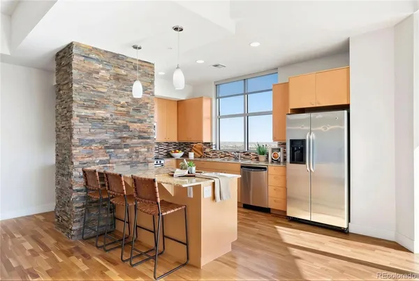 a kitchen with a sink cabinets and window