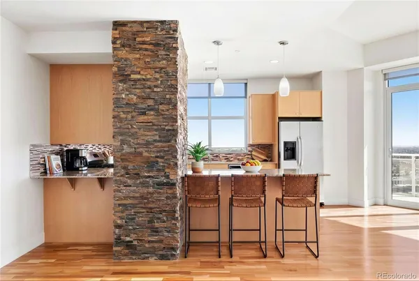 a view of cabinets and wooden floor