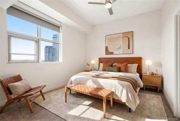 a bedroom with a bed and chair