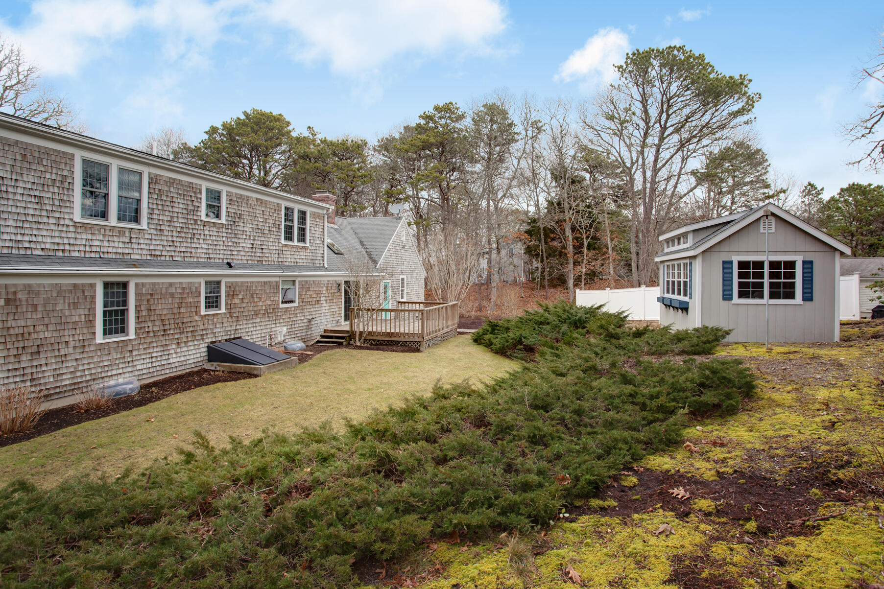 282 Elliott Road Centerville, MA 02632 - Photo 22 of 51 a view of a yard in front of a house with large tree