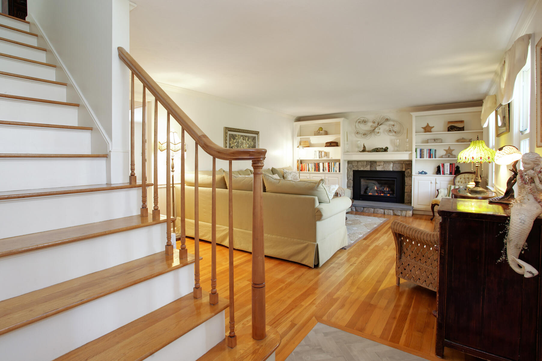 282 Elliott Road Centerville, MA 02632 - Photo 3 of 51 a living room with furniture and a fireplace
