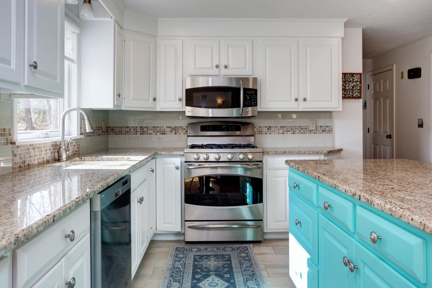 282 Elliott Road Centerville, MA 02632 - Photo 32 of 51 a kitchen with cabinets stainless steel appliances a sink and a stove