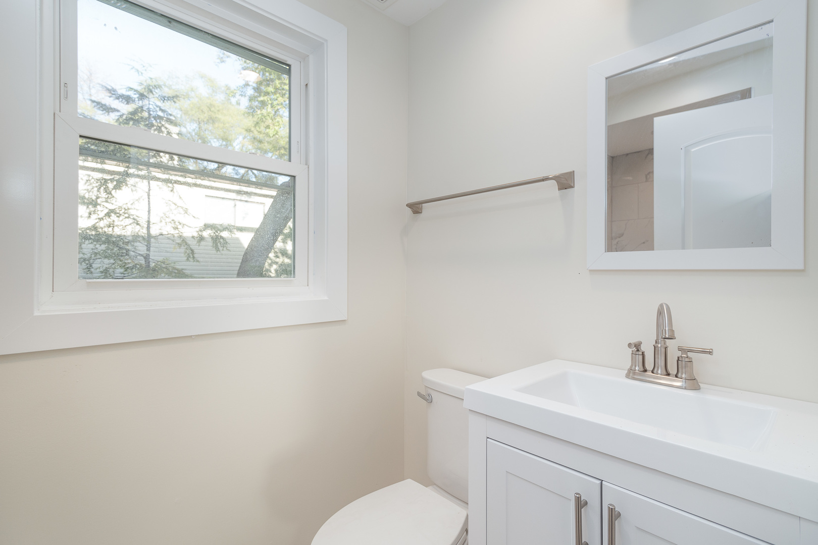 601 Pine Street Deerfield, IL 60015 - Photo 15 of 23 a bathroom with a granite countertop sink mirror and a toilet