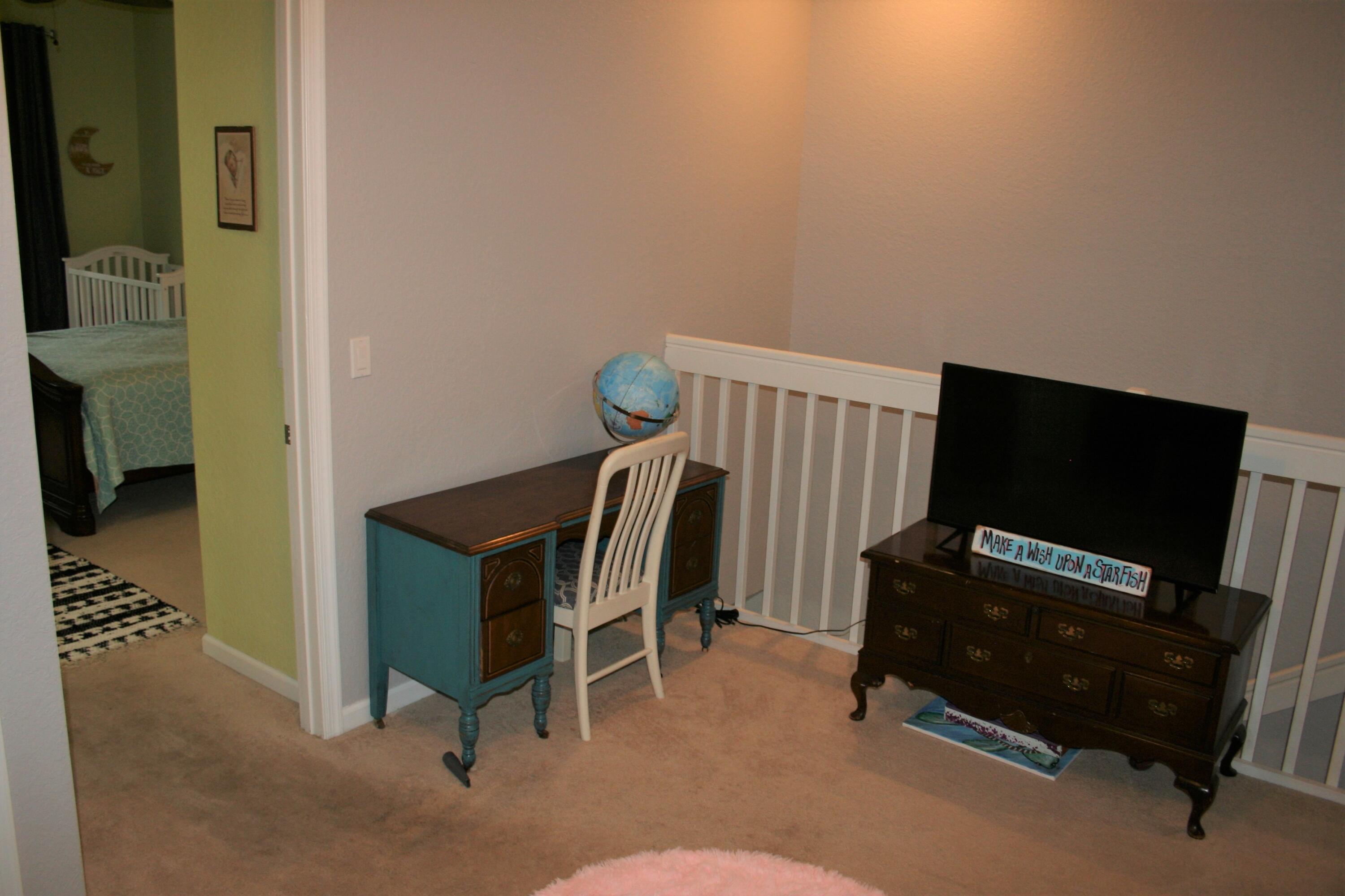 9469 Southwest Purple Martin Way Stuart, FL 34997 - Photo 14 of 23 a living room with furniture and a flat screen tv