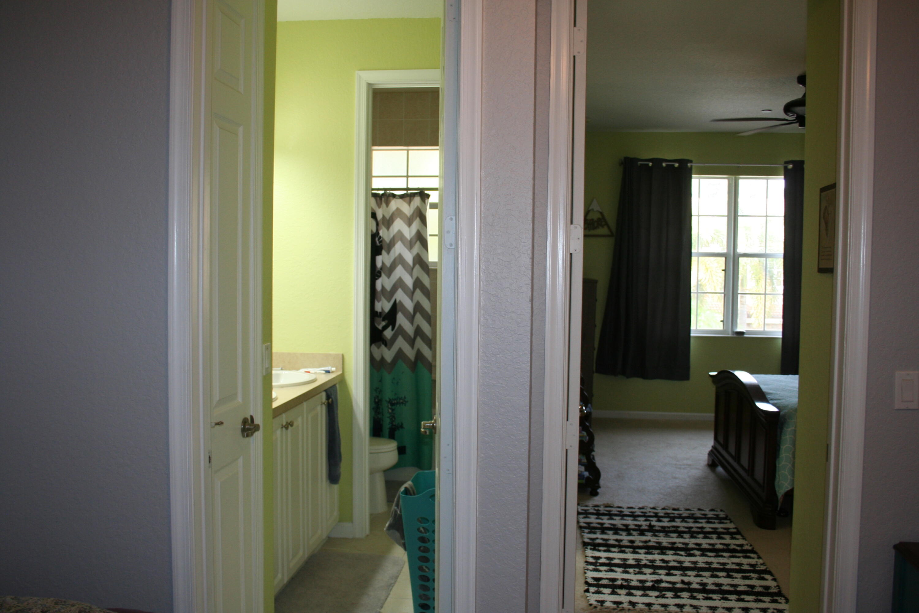 9469 Southwest Purple Martin Way Stuart, FL 34997 - Photo 15 of 23 a view of a hallway with a wooden door