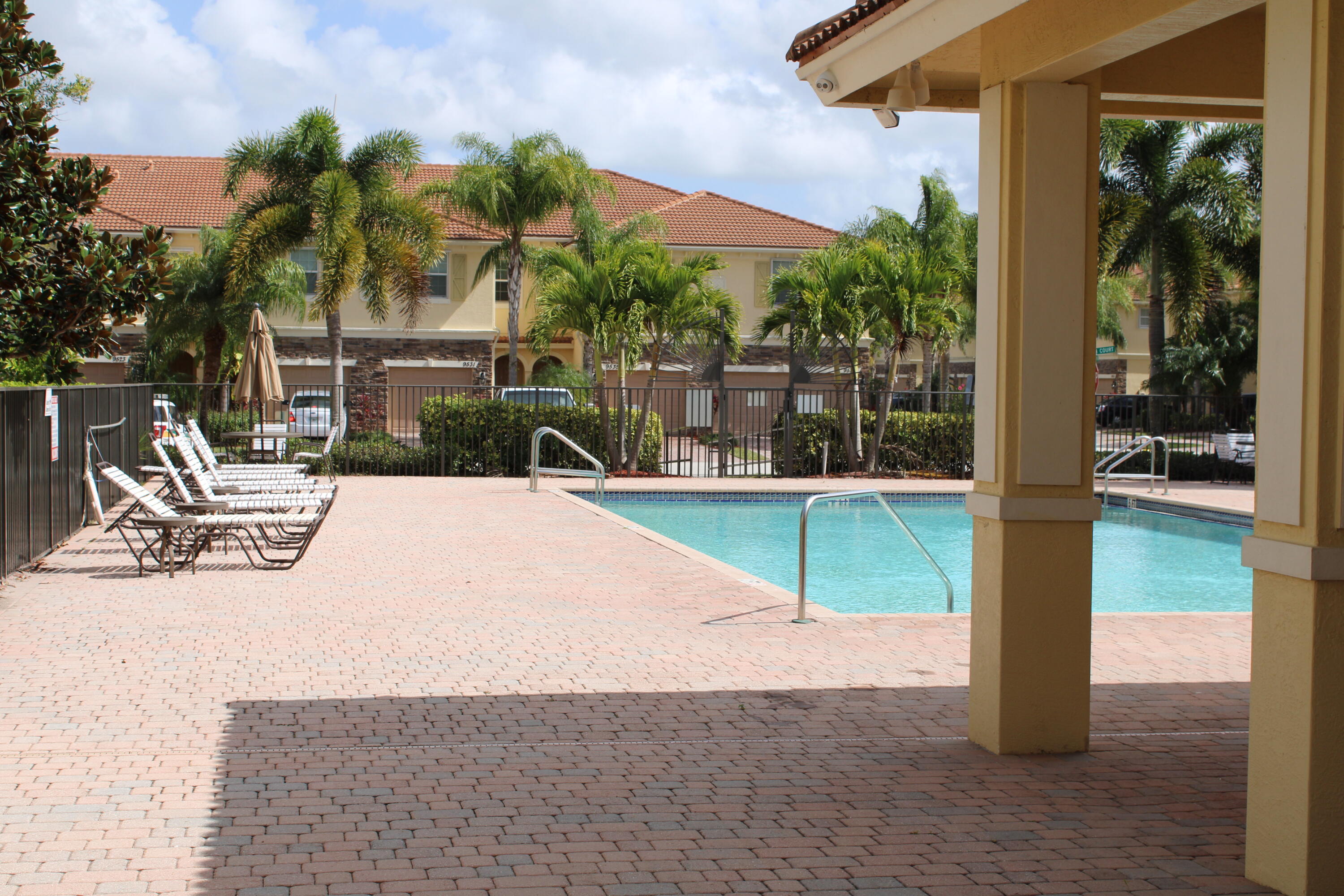 9469 Southwest Purple Martin Way Stuart, FL 34997 - Photo 22 of 23 a view of a swimming pool with a patio