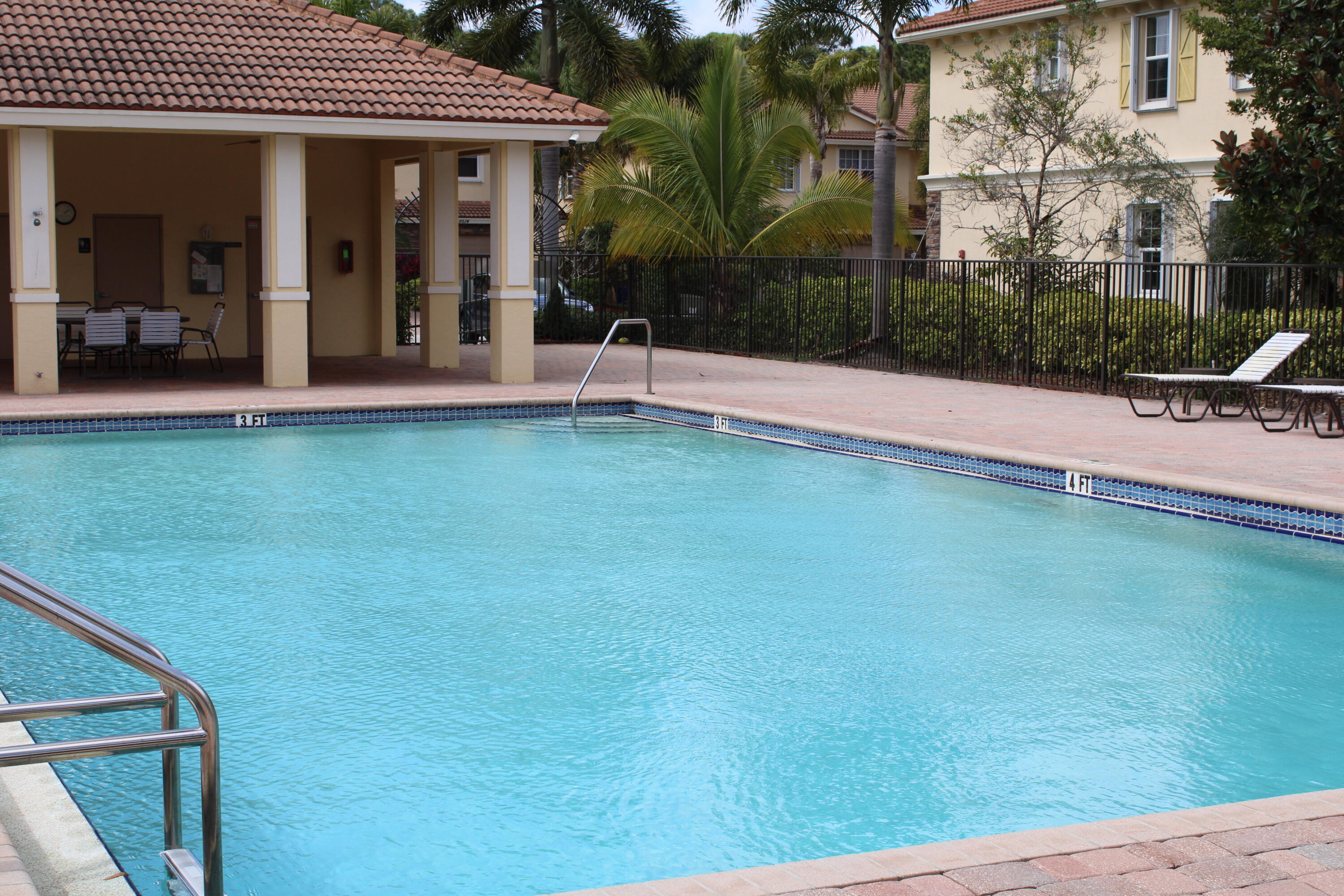 9469 Southwest Purple Martin Way Stuart, FL 34997 - Photo 23 of 23 a view of a house with a garden