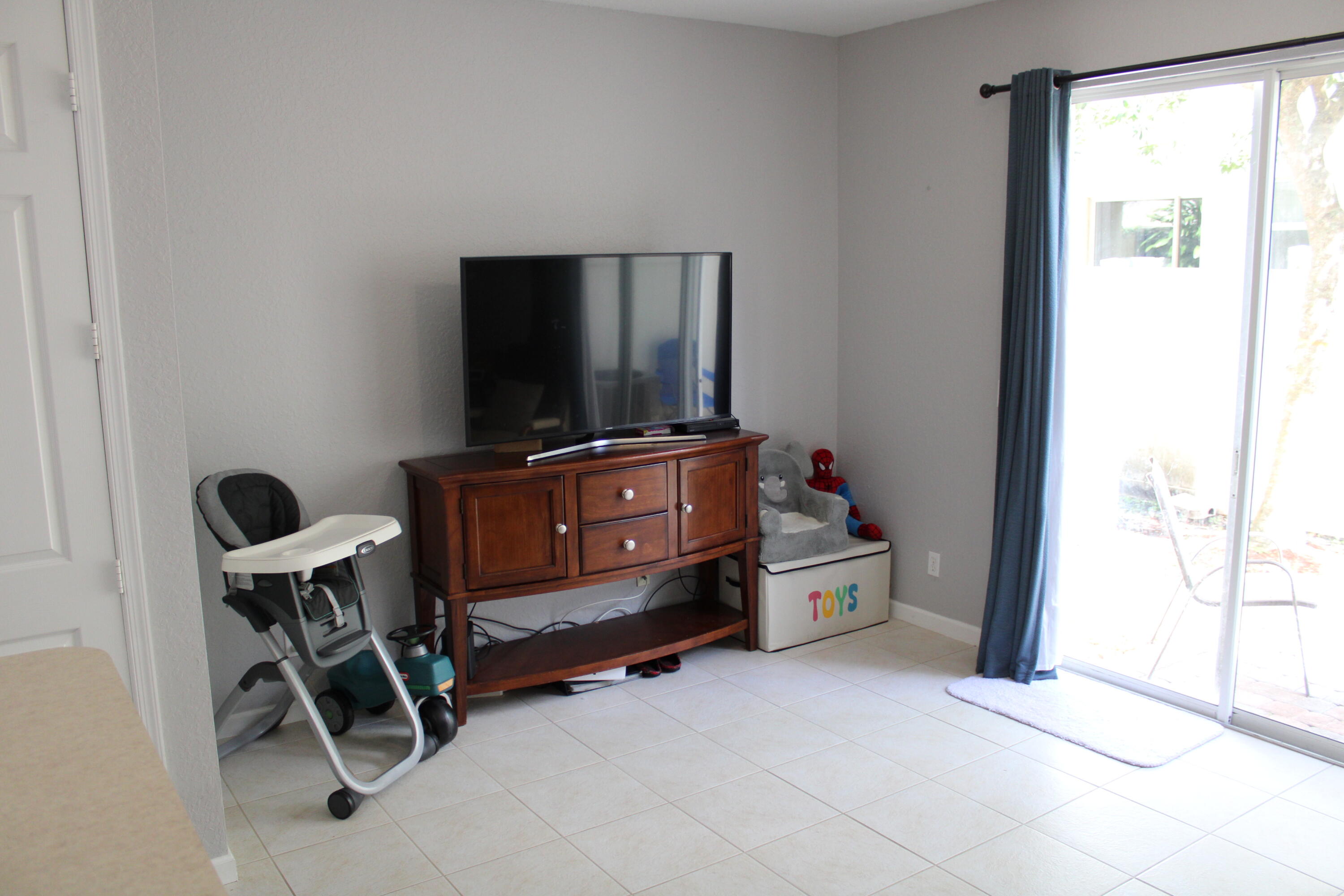 9469 Southwest Purple Martin Way Stuart, FL 34997 - Photo 10 of 23 a room with furniture and windows