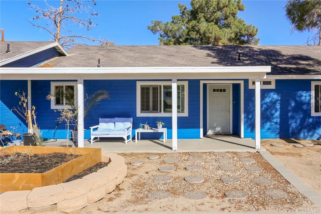 10233 Sahara Road Phelan, CA 92371 - Photo 1 of 1 a view of a dinning room with a patio