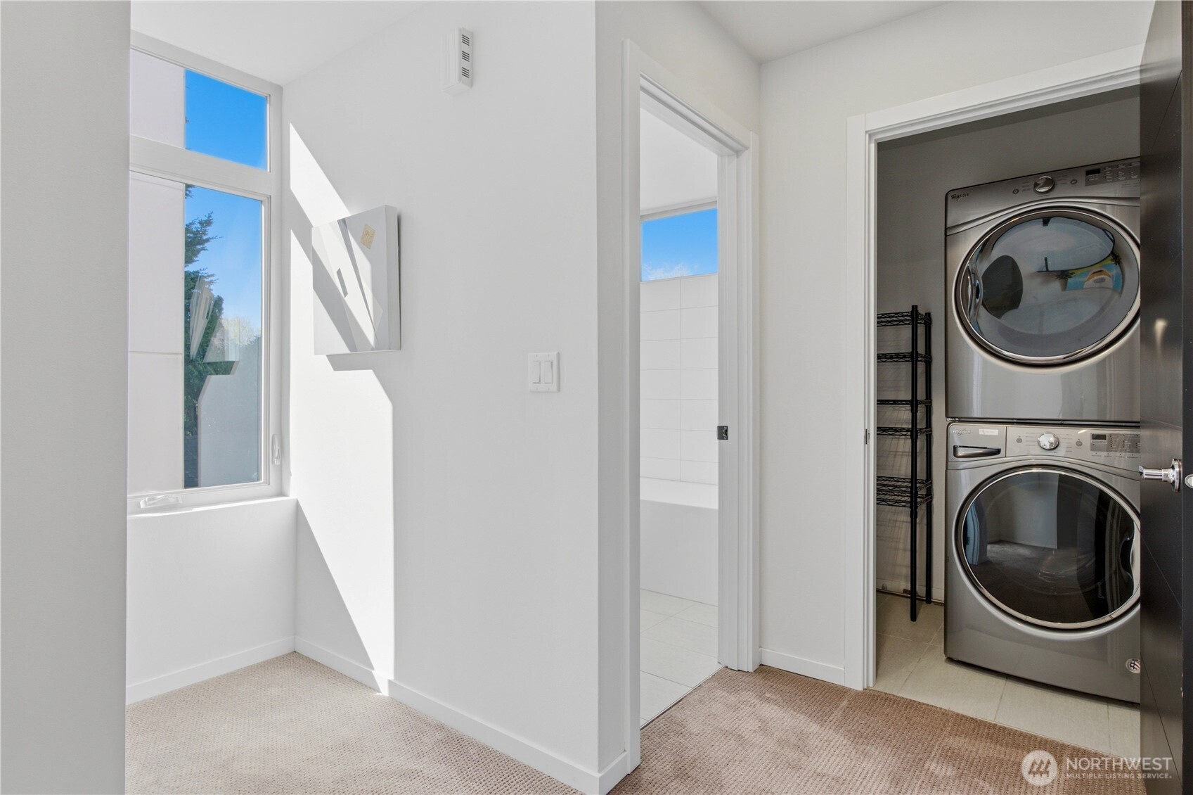 2033 Northwest 65th Street Seattle, WA 98117 - Photo 12 of 20 a view of a storage and utility room with washer and dryer