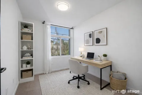 a view of a workspace with furniture