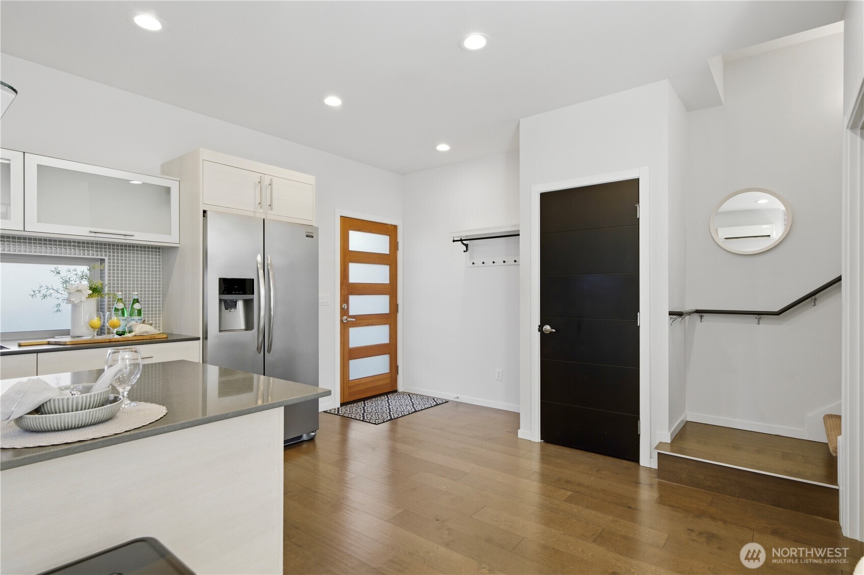 2033 Northwest 65th Street Seattle, WA 98117 - Photo 7 of 20 a kitchen with stainless steel appliances granite countertop a refrigerator and a sink