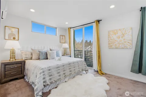 a bedroom with a large bed and a window