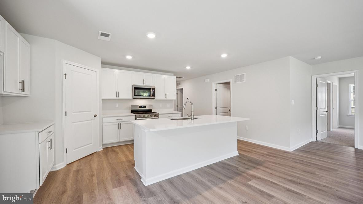311 Vero Road Egg Harbor Township, NJ 08234 - Photo 14 of 27 a view of kitchen with sink microwave and stove