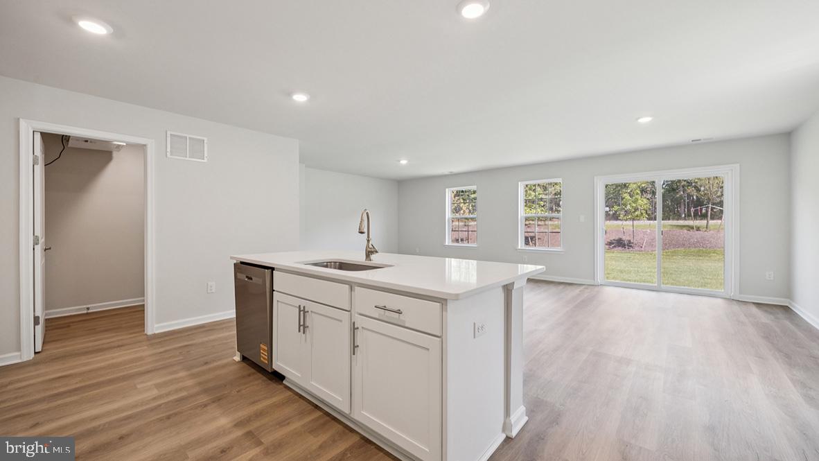 311 Vero Road Egg Harbor Township, NJ 08234 - Photo 16 of 27 a view of a kitchen with wooden floor and a sink