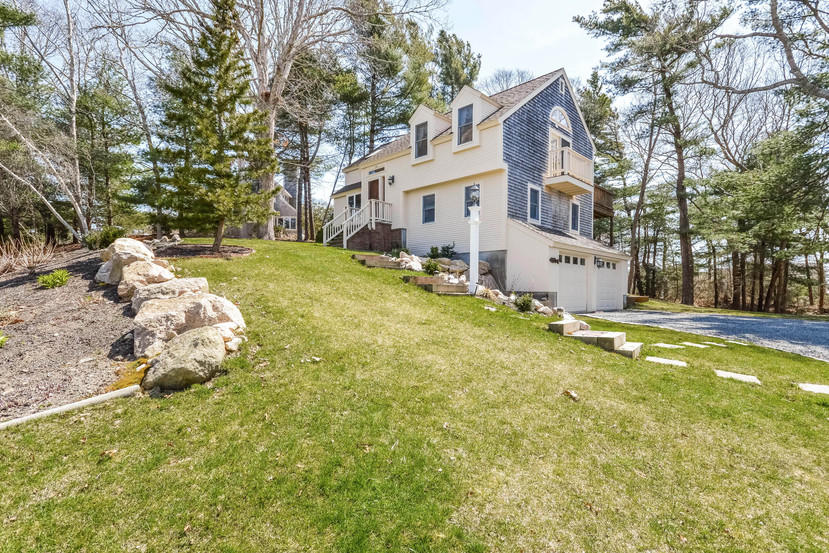 114 Elgin Road Pocasset, MA 02559 - Photo 3 of 34 a view of a white house with a large tree and yard