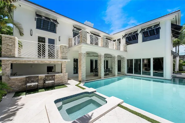 a bedroom with large windows and large window